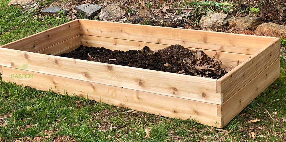 Raised garden bed being assembled